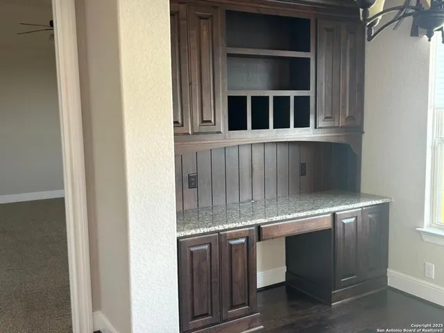 a bedroom with bed and a window