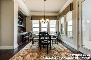 a view of a dining room with furniture window and outside view
