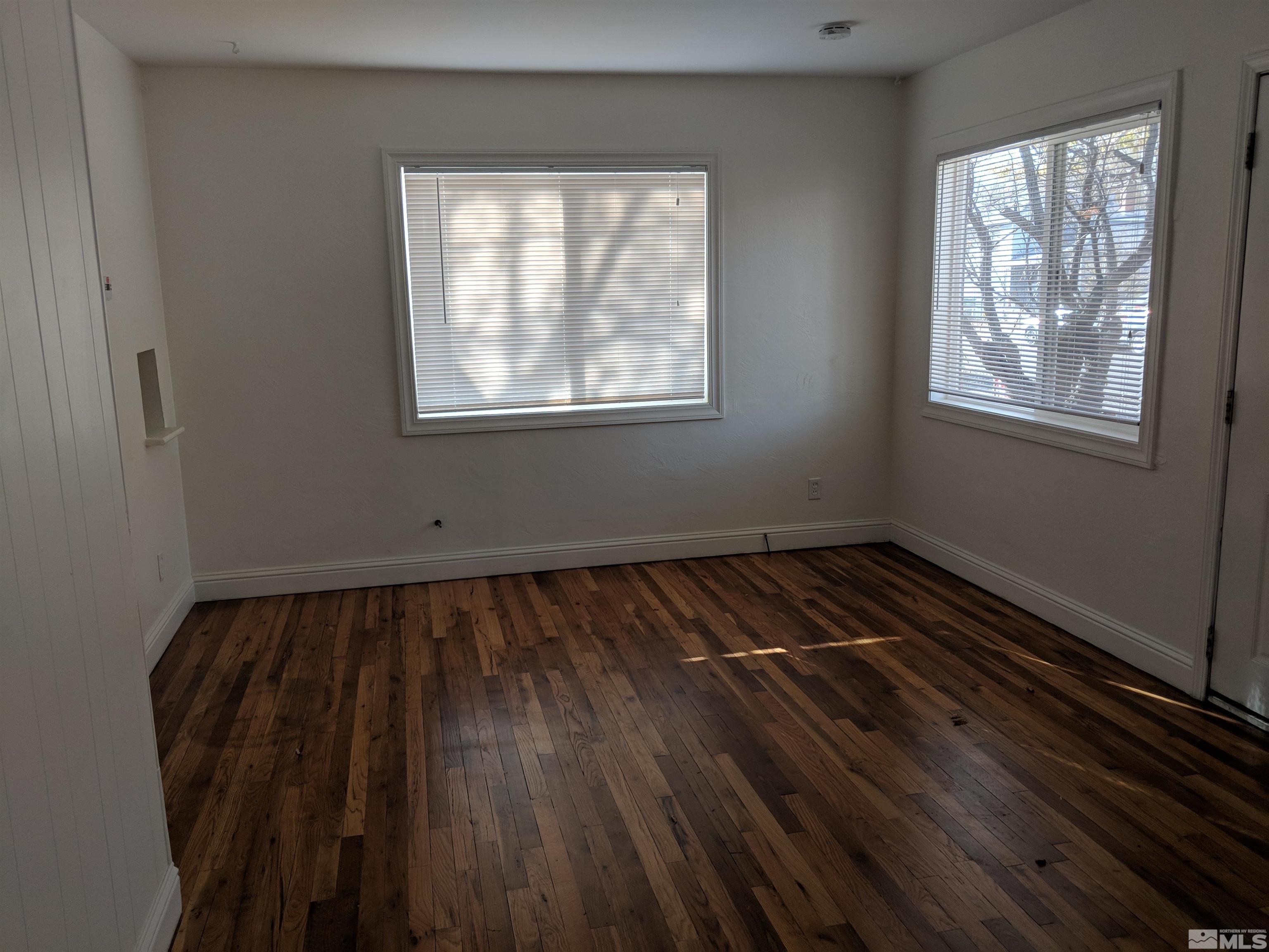 824-828 Locust Street Reno, NV 89502 - Photo 23 of 38 a view of a room with wooden floor and windows
