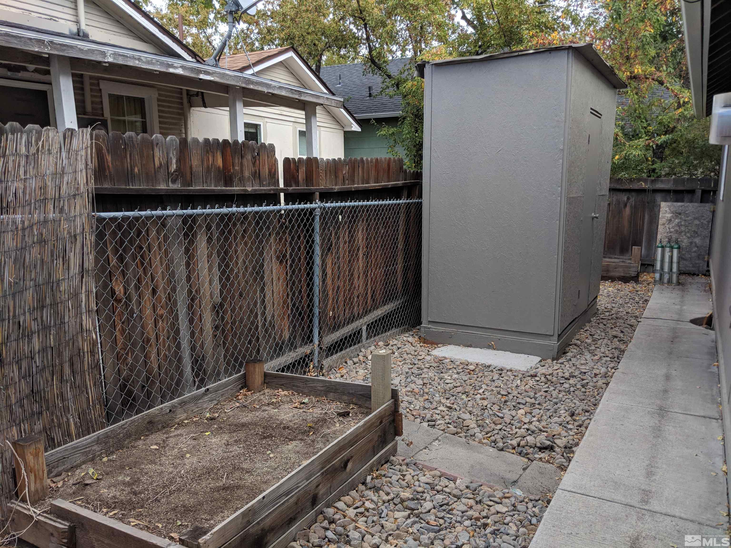 824-828 Locust Street Reno, NV 89502 - Photo 37 of 38 a view of a house with wooden fence