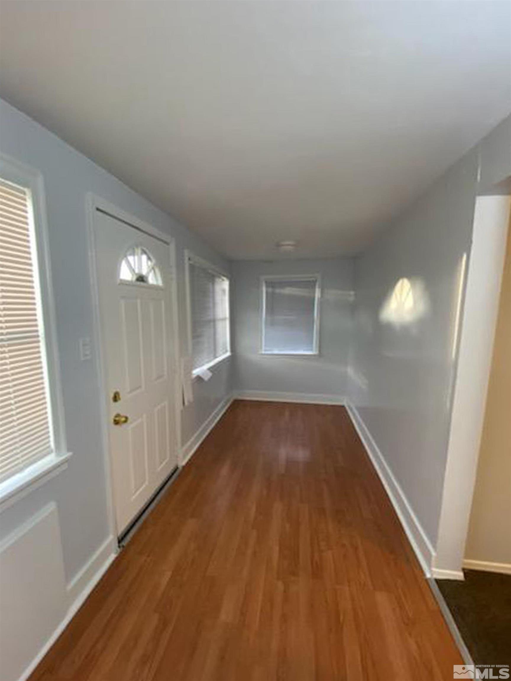 824-828 Locust Street Reno, NV 89502 - Photo 10 of 38 a view of empty room with wooden floor and fan