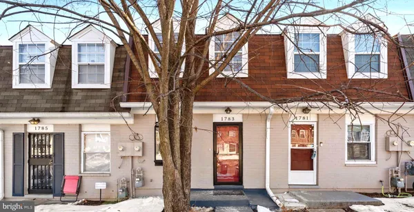 a front view of a building with a lot of windows