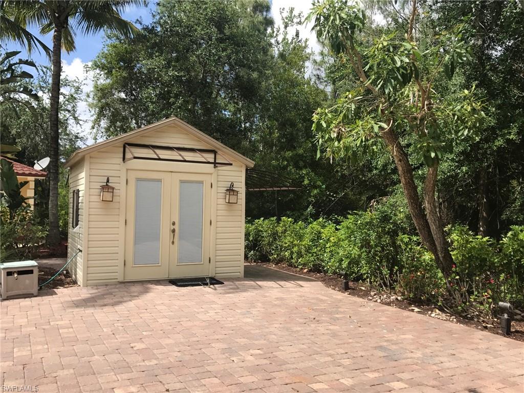 4914 Coach Lane Naples, FL 34114 - Photo 4 of 12 View of outdoor structure with view of scattered trees