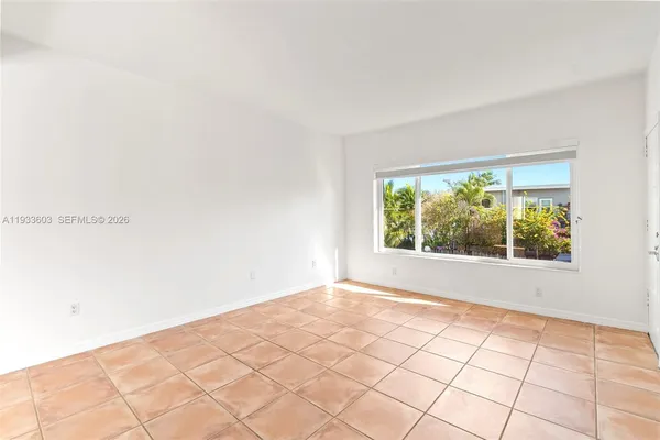 a view of an empty room and window