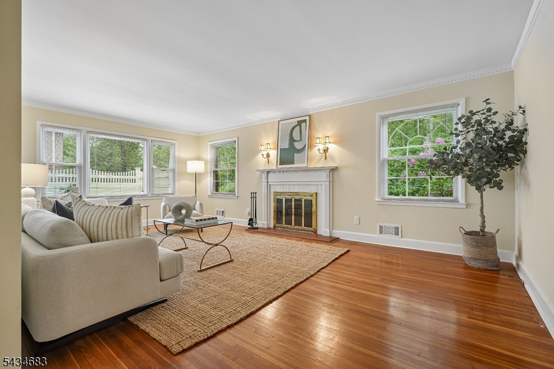 106 Division Avenue Summit, NJ 07901 - Photo 7 of 38 a living room with furniture and a fireplace