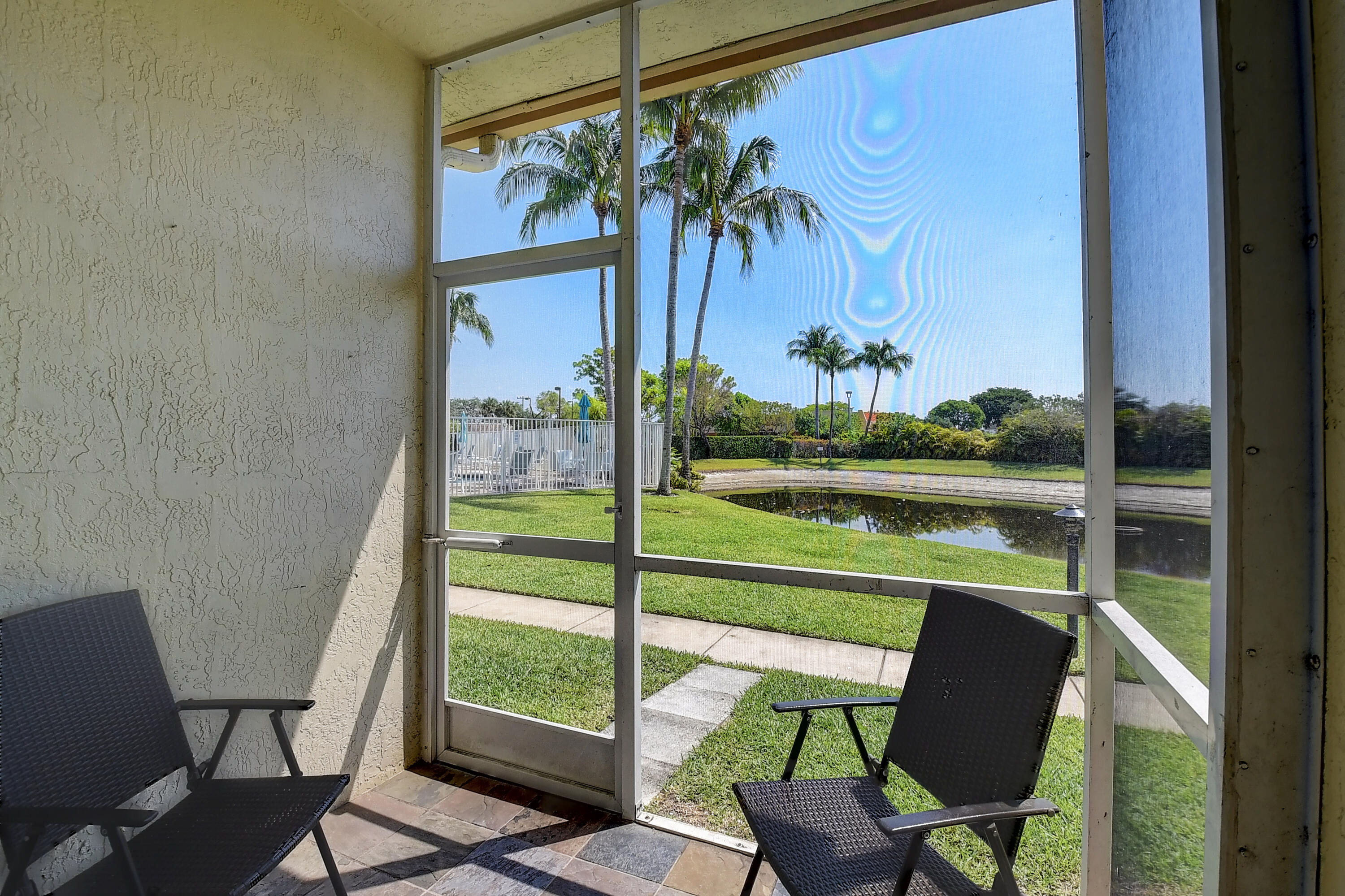 105 Coconut Key Lane Delray Beach, FL 33484 - Photo 17 of 24 Screened In Patio and View