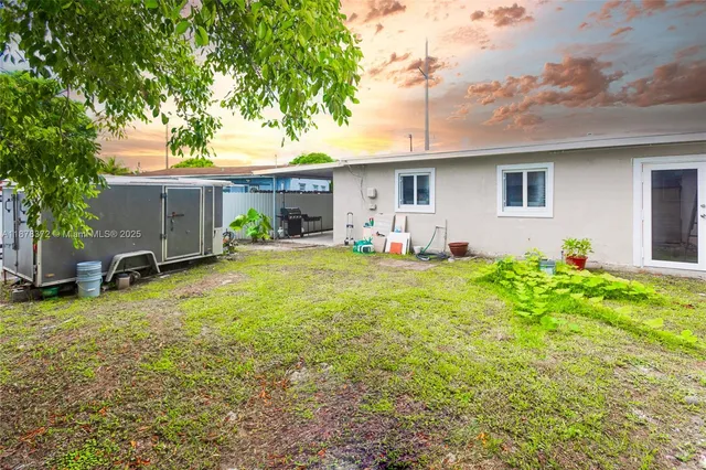 a front view of house with yard and seating area