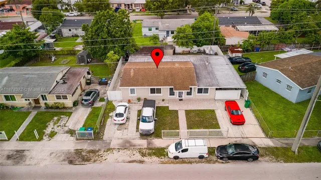 an aerial view of multiple houses with outdoor space