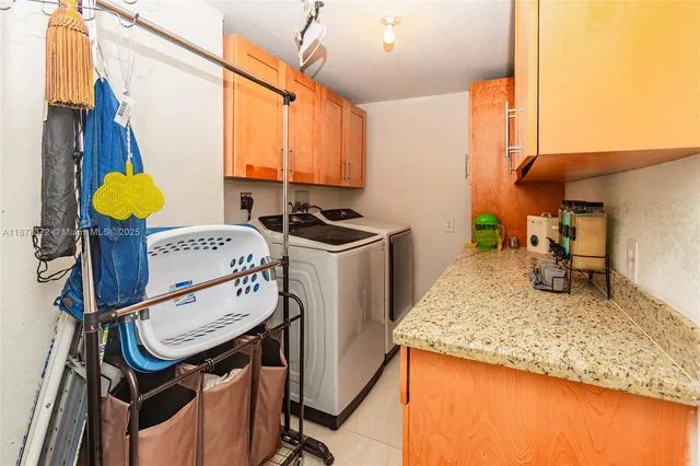 a kitchen with a sink a stove and a refrigerator