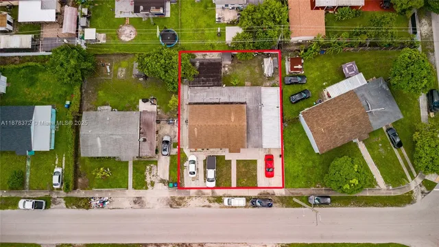 front view of house with a yard and a fountain