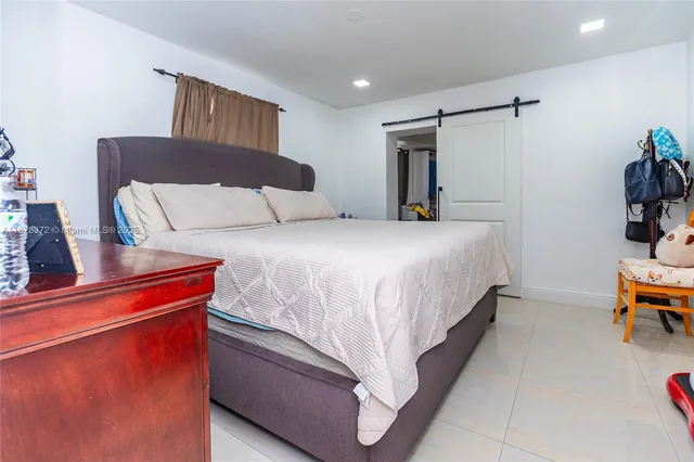 a bedroom with a bed and a table