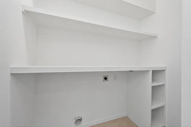 a view of room with hardwood floor and window