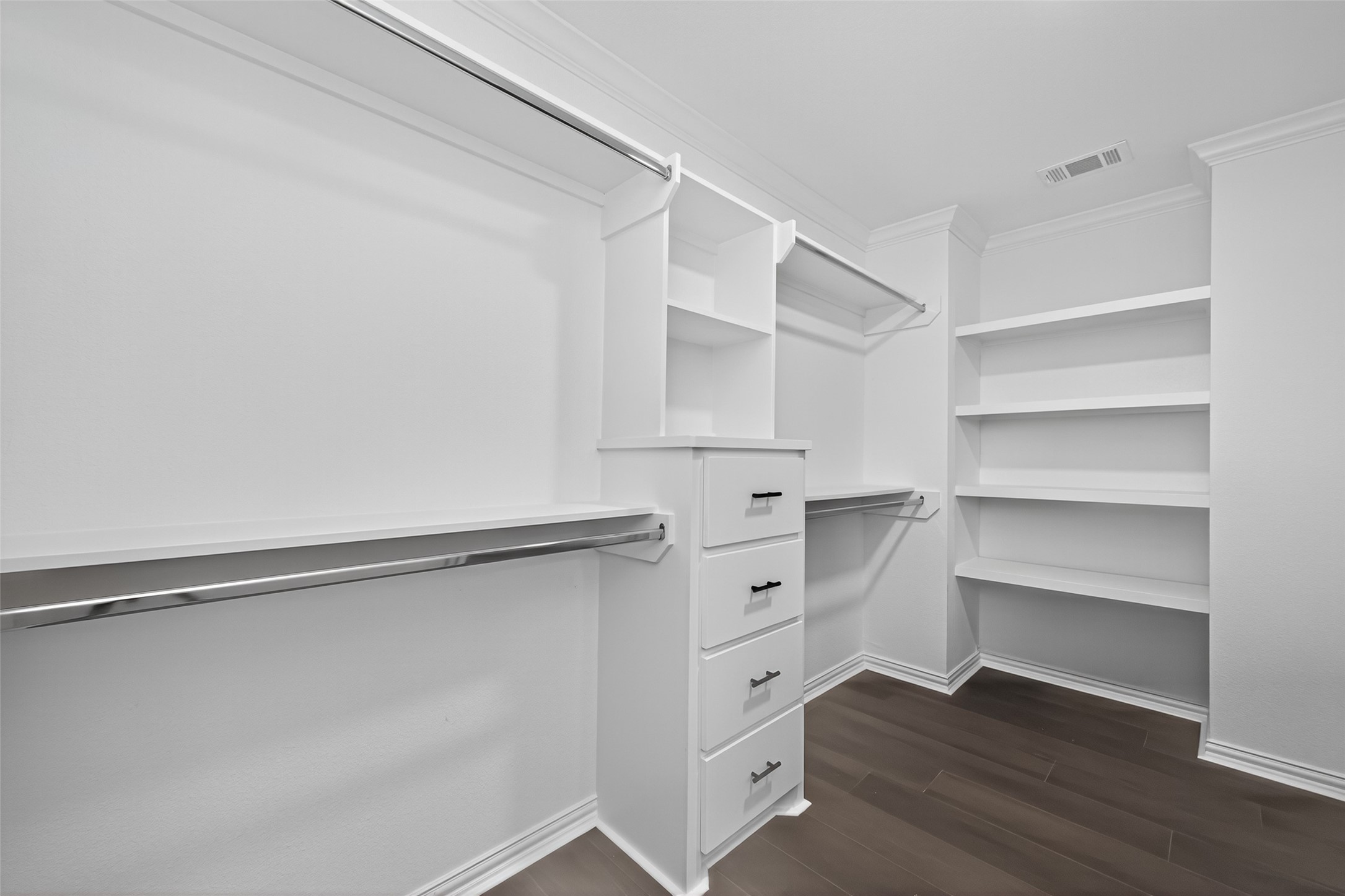 10594 Rustling Oaks Drive Conroe, TX 77303 - Photo 16 of 40 a view of walk in closet with empty racks