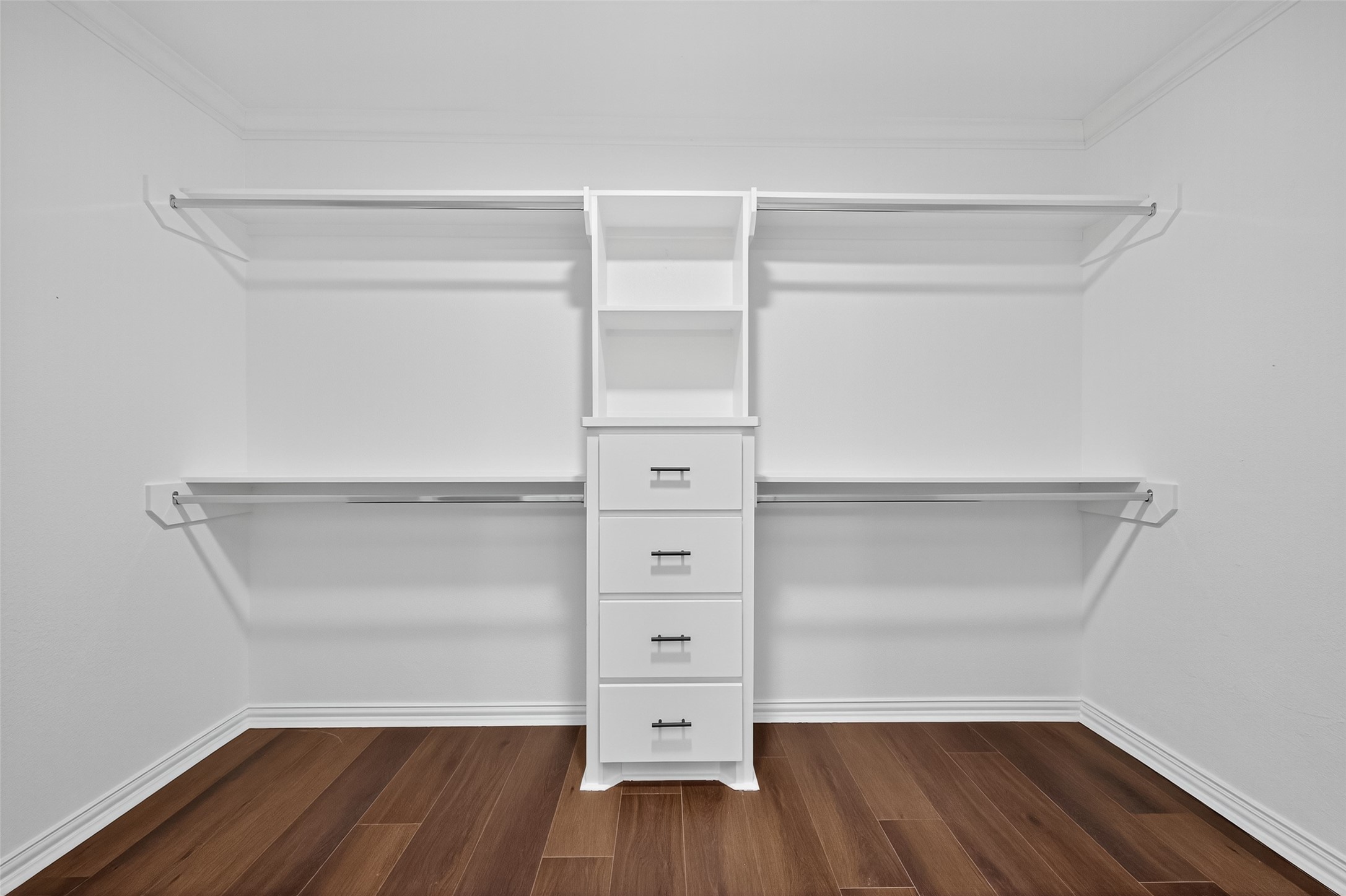 10594 Rustling Oaks Drive Conroe, TX 77303 - Photo 22 of 40 a view of walk in closet with empty racks