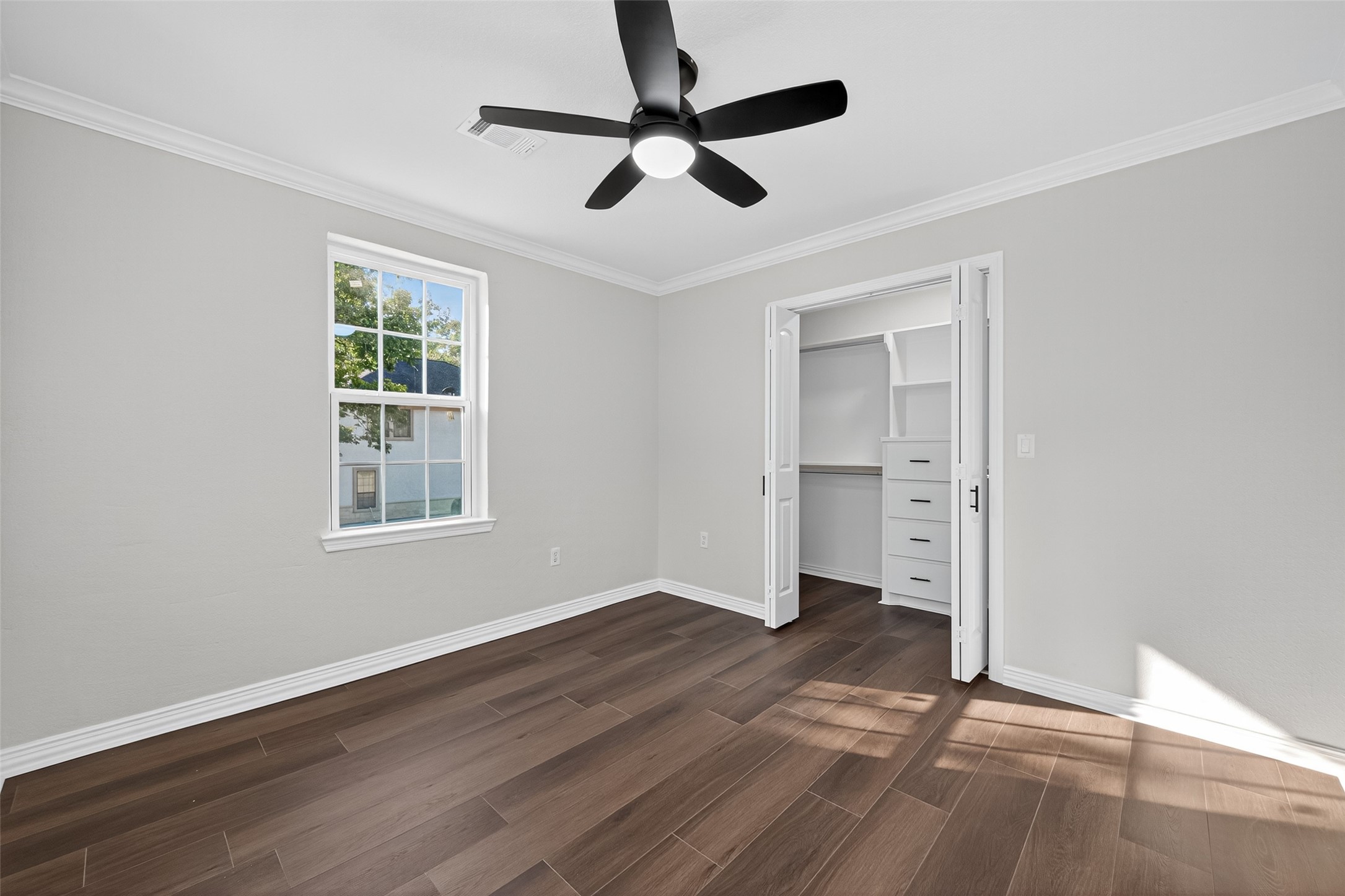 10594 Rustling Oaks Drive Conroe, TX 77303 - Photo 25 of 40 a view of an empty room with a window