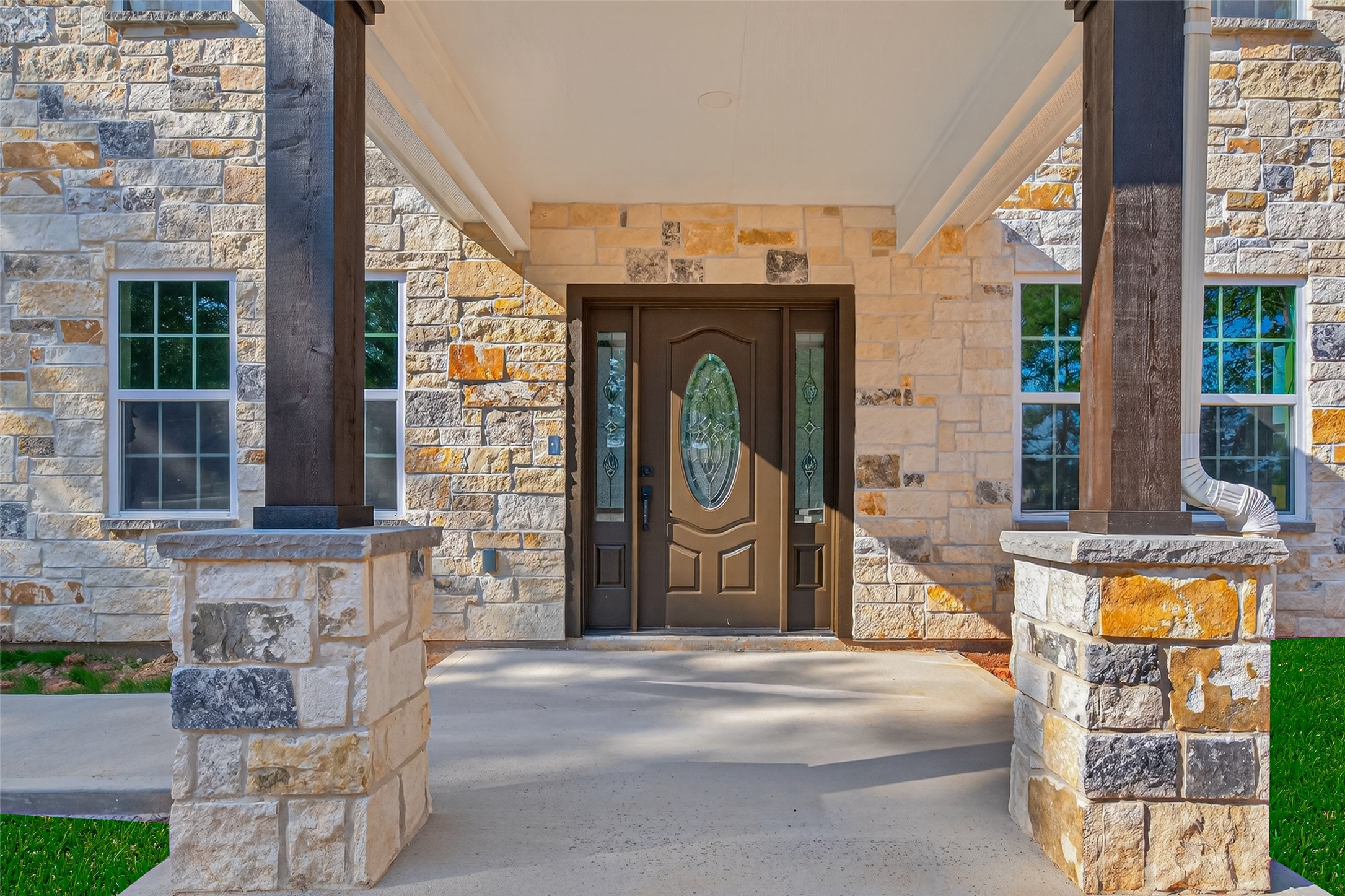 10594 Rustling Oaks Drive Conroe, TX 77303 - Photo 3 of 40 a front view of a building with glass windows and door
