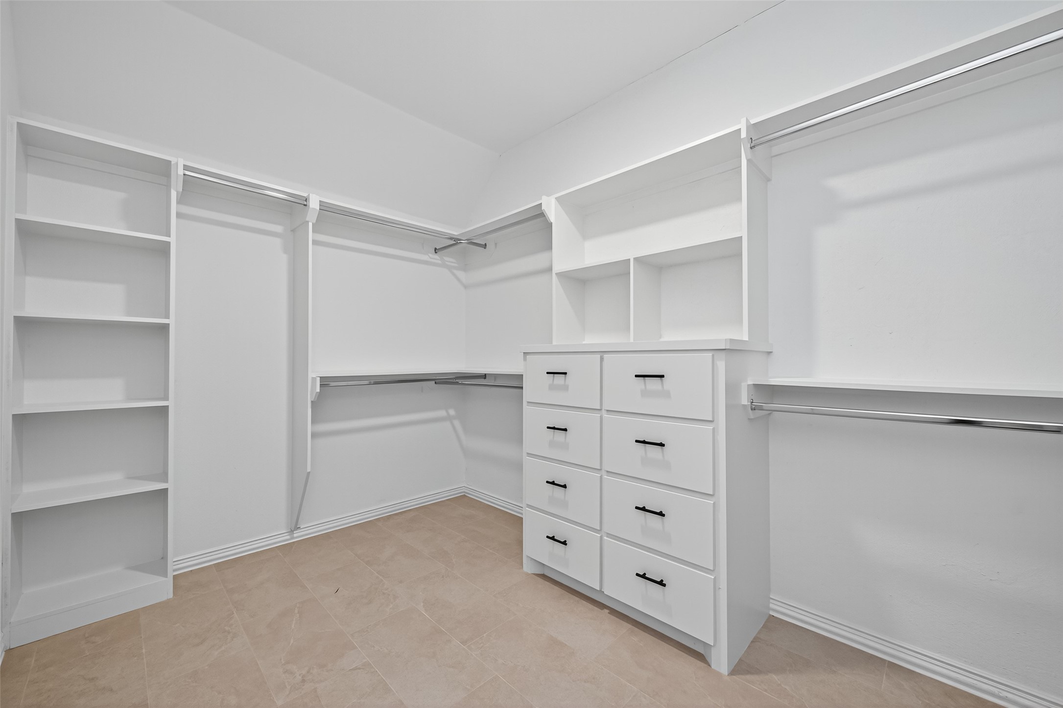 10594 Rustling Oaks Drive Conroe, TX 77303 - Photo 34 of 40 a view of walk in closet with empty racks