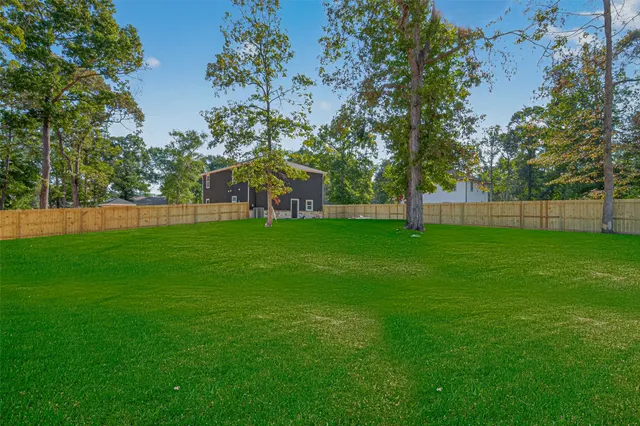 a view of a house with a big yard