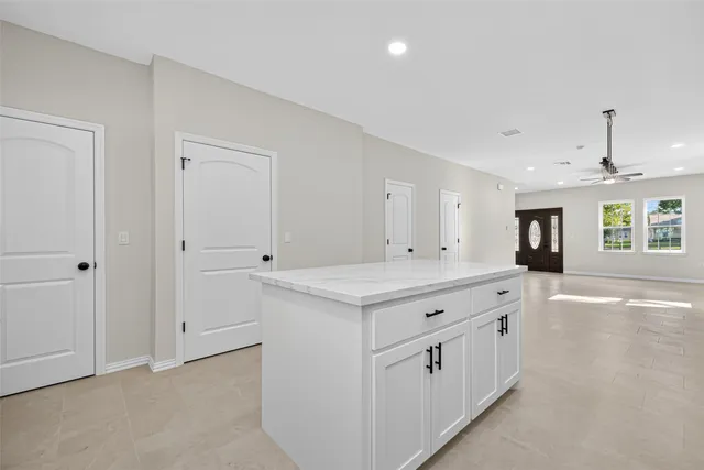 a kitchen with stainless steel appliances granite countertop a stove and a refrigerator