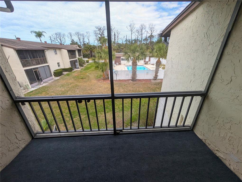 5521 Bay Boulevard, Unit 201 Port Richey, FL 34668 - Photo 7 of 12 a view of balcony with patio