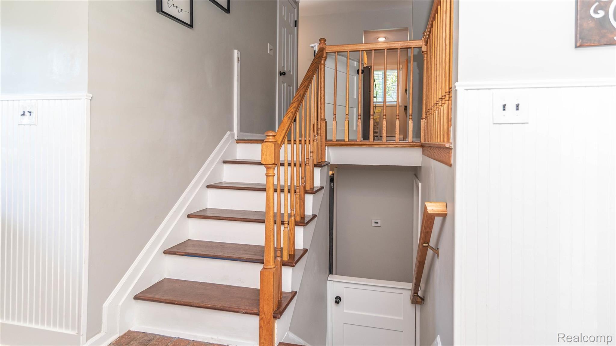 1981 Roxbury Run Wixom, MI 48393 - Photo 15 of 57 STAIRCASE TO UPPER AND LOWER LEVELS