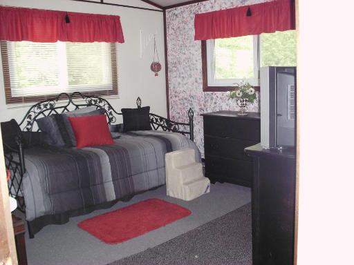 1915 East Clark Street Diamond, IL 60416 - Photo 7 of 14 a bedroom with a bed and a window