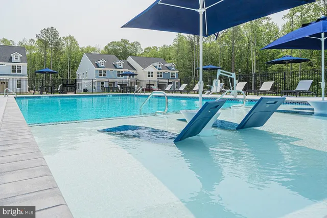a view of a backyard with sitting area