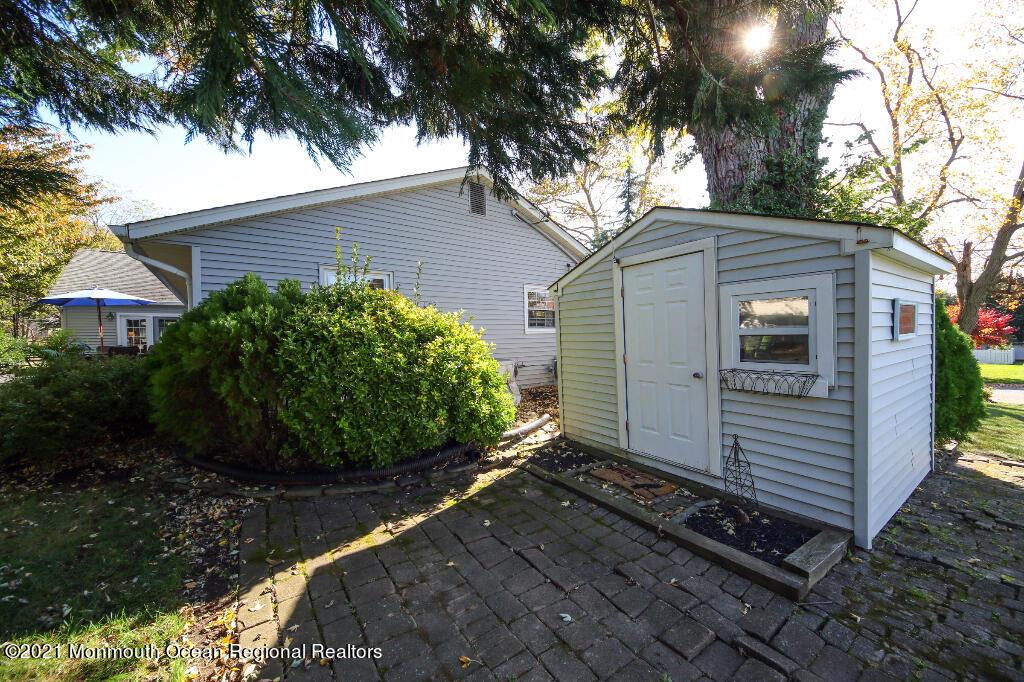 1132 Mohegan Road Manasquan, NJ 08736 - Photo 11 of 35 a view of a house with a yard