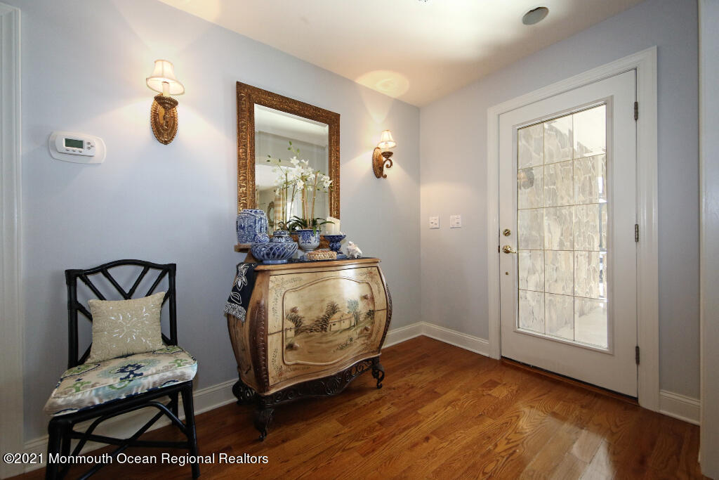 1132 Mohegan Road Manasquan, NJ 08736 - Photo 12 of 35 a view of room with furniture and wooden floor