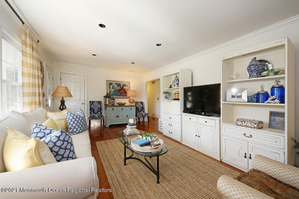 1132 Mohegan Road Manasquan, NJ 08736 - Photo 14 of 35 a living room with furniture and a flat screen tv