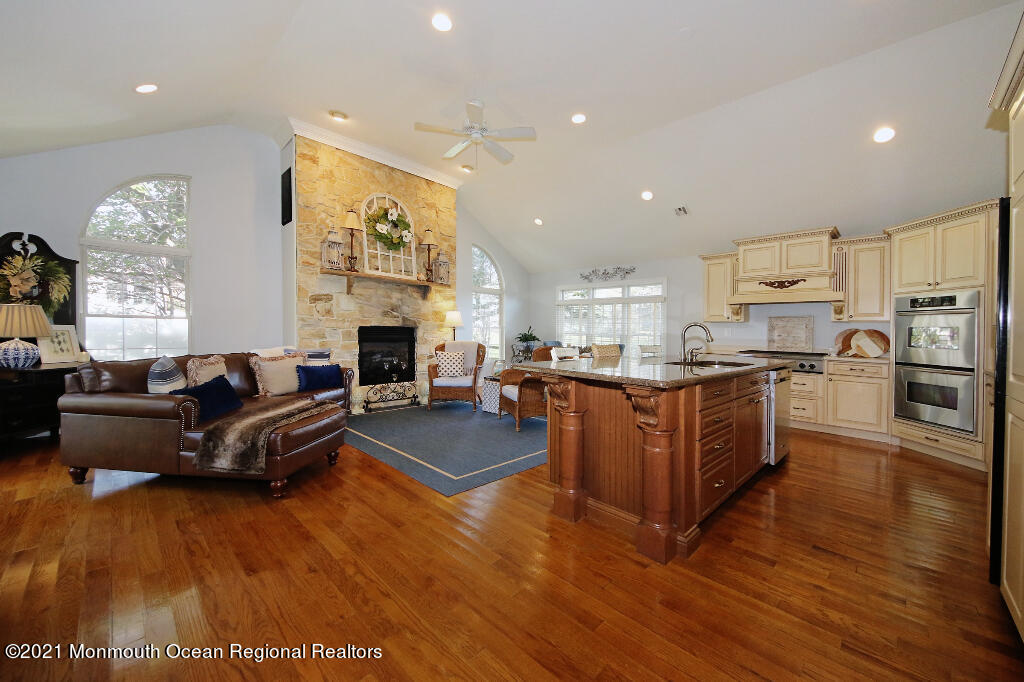 1132 Mohegan Road Manasquan, NJ 08736 - Photo 15 of 35 a living room with furniture and a fireplace