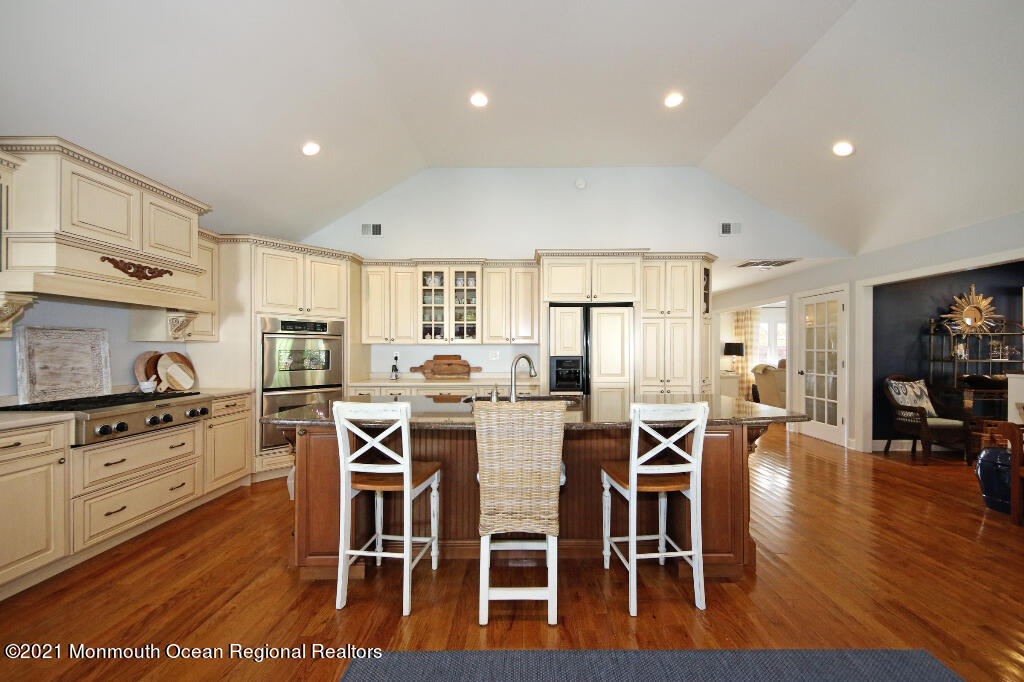 1132 Mohegan Road Manasquan, NJ 08736 - Photo 17 of 35 a view of kitchen with cabinets table and chairs