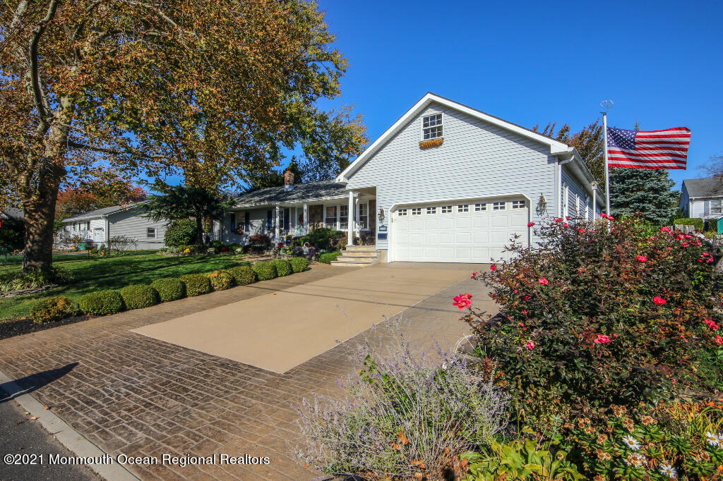 1132 Mohegan Road Manasquan, NJ 08736 - Photo 3 of 35 a view of a house with a yard and potted plants