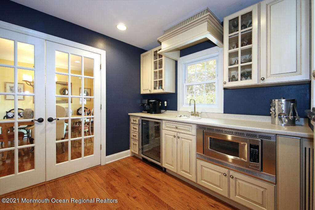 1132 Mohegan Road Manasquan, NJ 08736 - Photo 23 of 35 a kitchen with stainless steel appliances granite countertop a stove and a sink