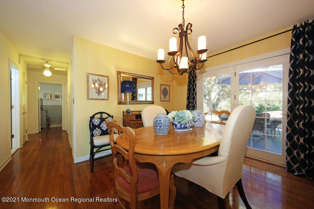 1132 Mohegan Road Manasquan, NJ 08736 - Photo 25 of 35 a view of a dining room with furniture window and wooden floor