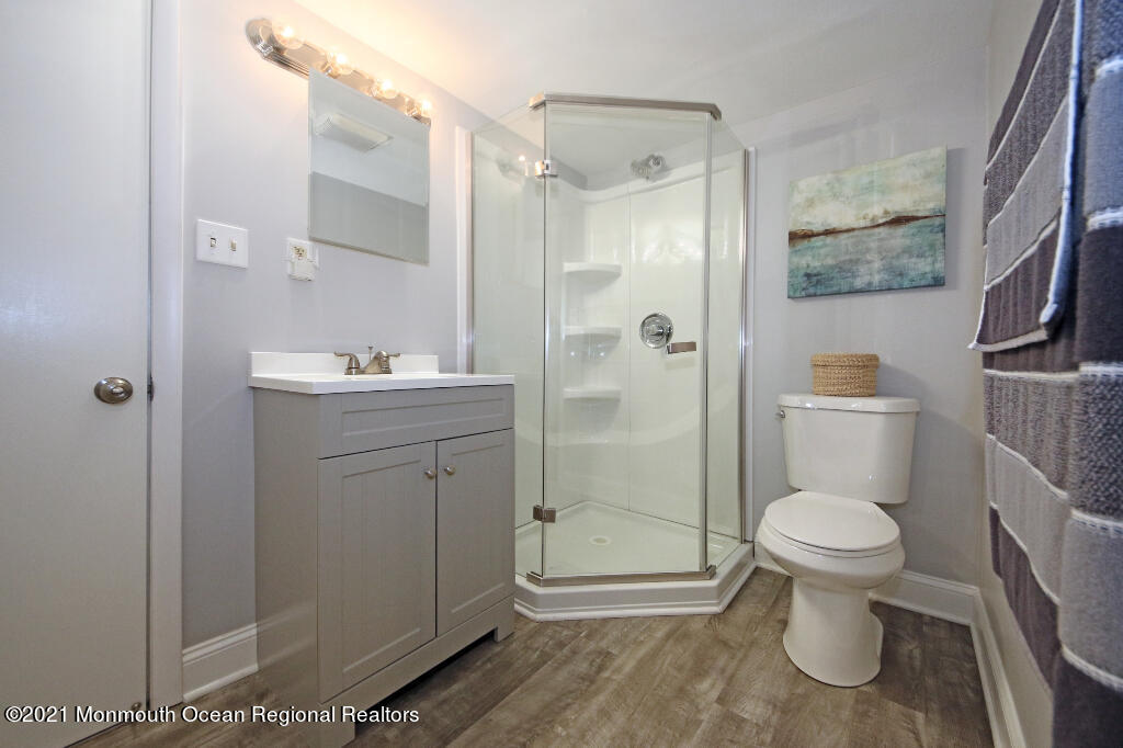 1132 Mohegan Road Manasquan, NJ 08736 - Photo 34 of 35 a bathroom with a toilet sink and shower