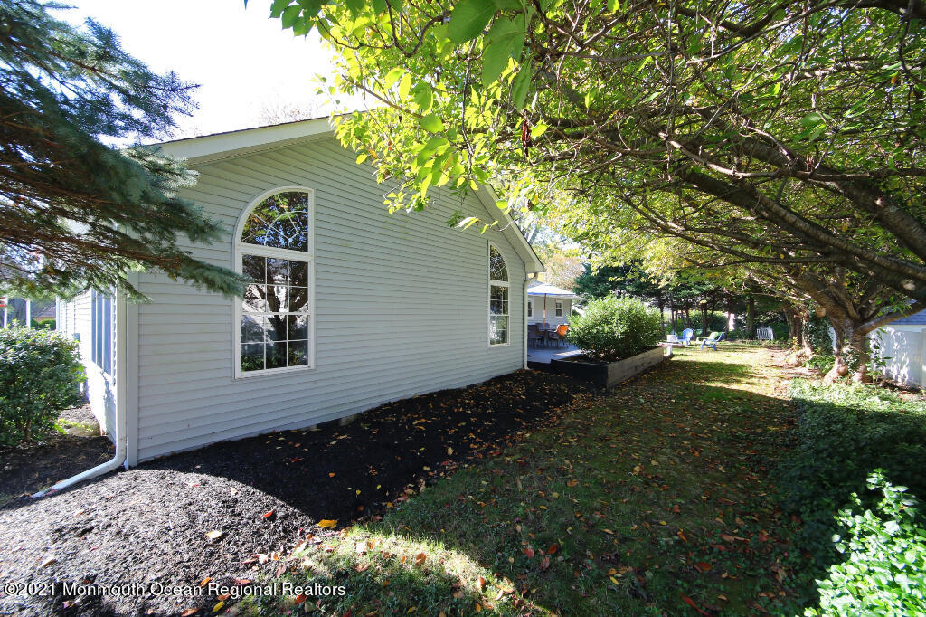 1132 Mohegan Road Manasquan, NJ 08736 - Photo 5 of 35 a front view of a house with garden