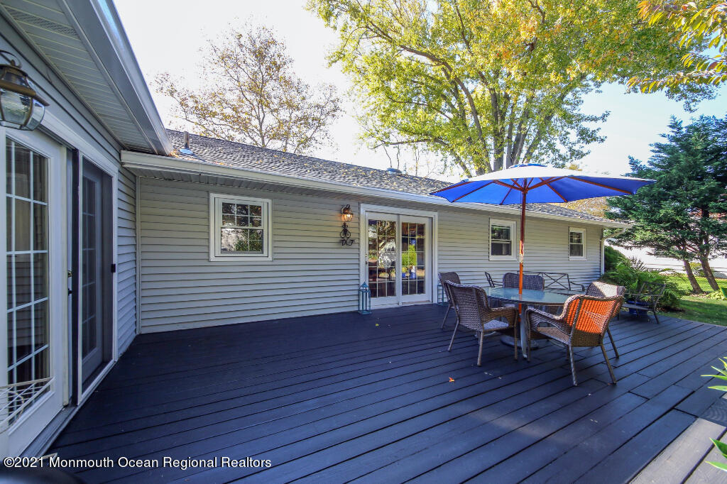 1132 Mohegan Road Manasquan, NJ 08736 - Photo 7 of 35 a view of a house with a patio and wooden flooring