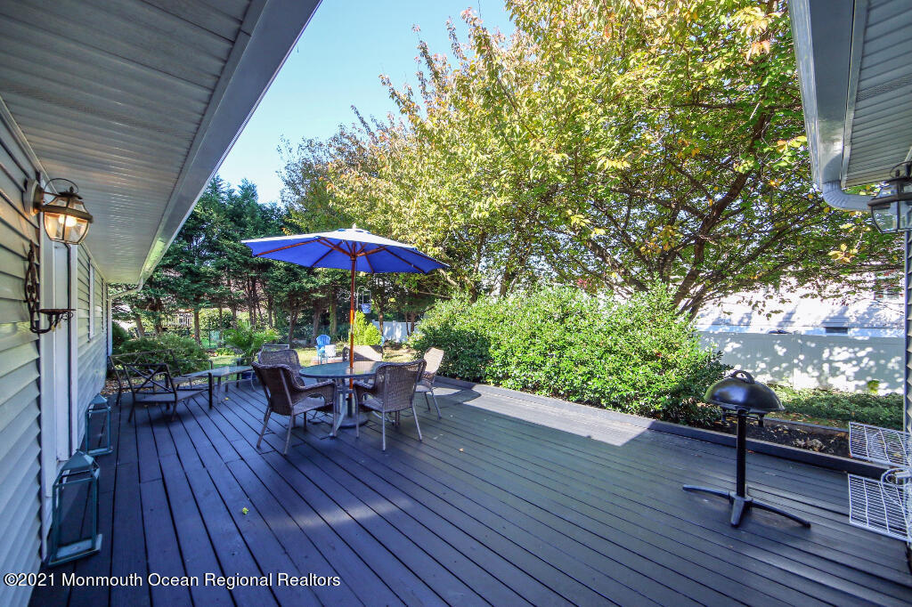 1132 Mohegan Road Manasquan, NJ 08736 - Photo 8 of 35 an outdoor space with furniture and wooden floor