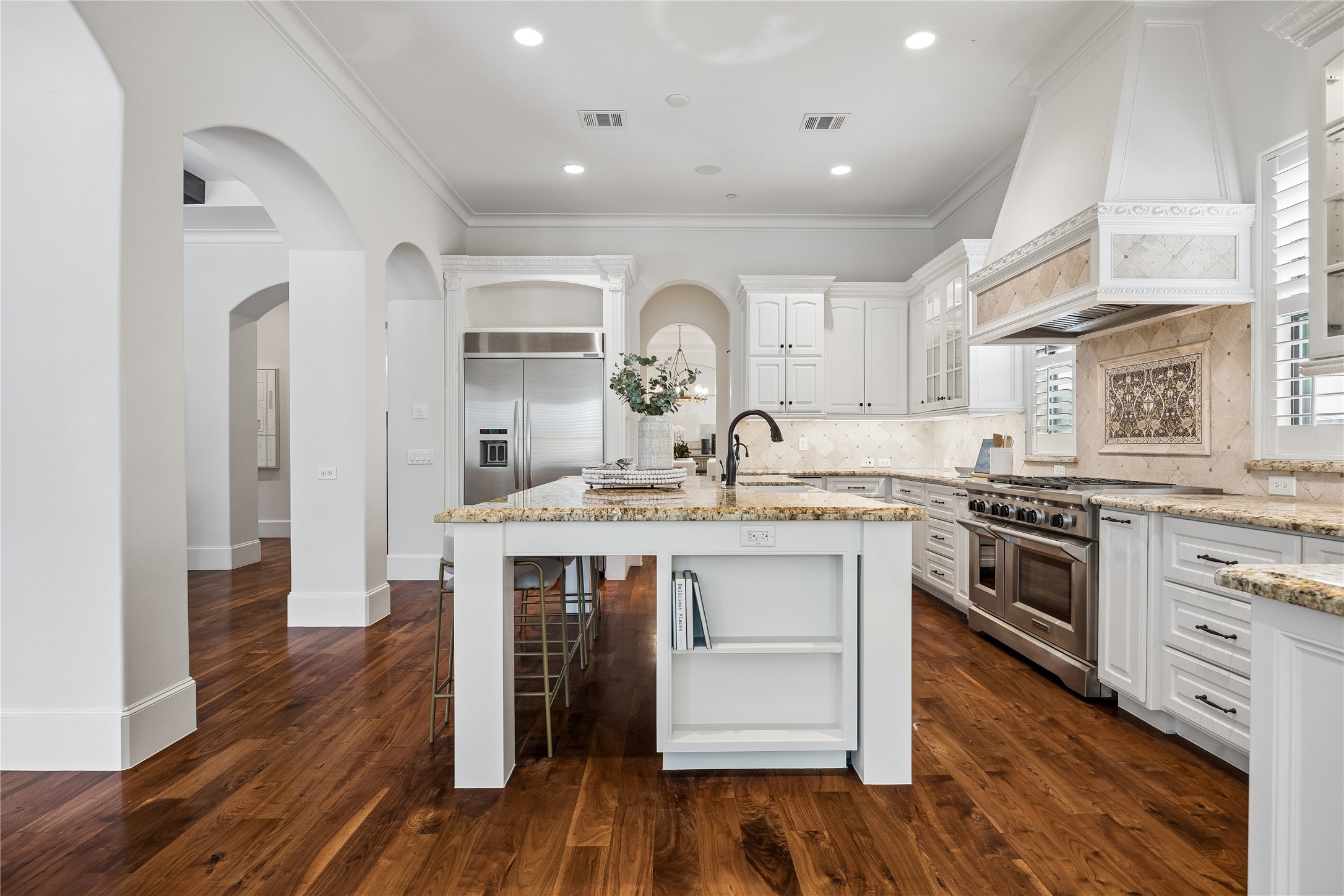 4511 Merrie Lane Bellaire, TX 77401 - Photo 17 of 46 a kitchen with a sink cabinets and wooden floor