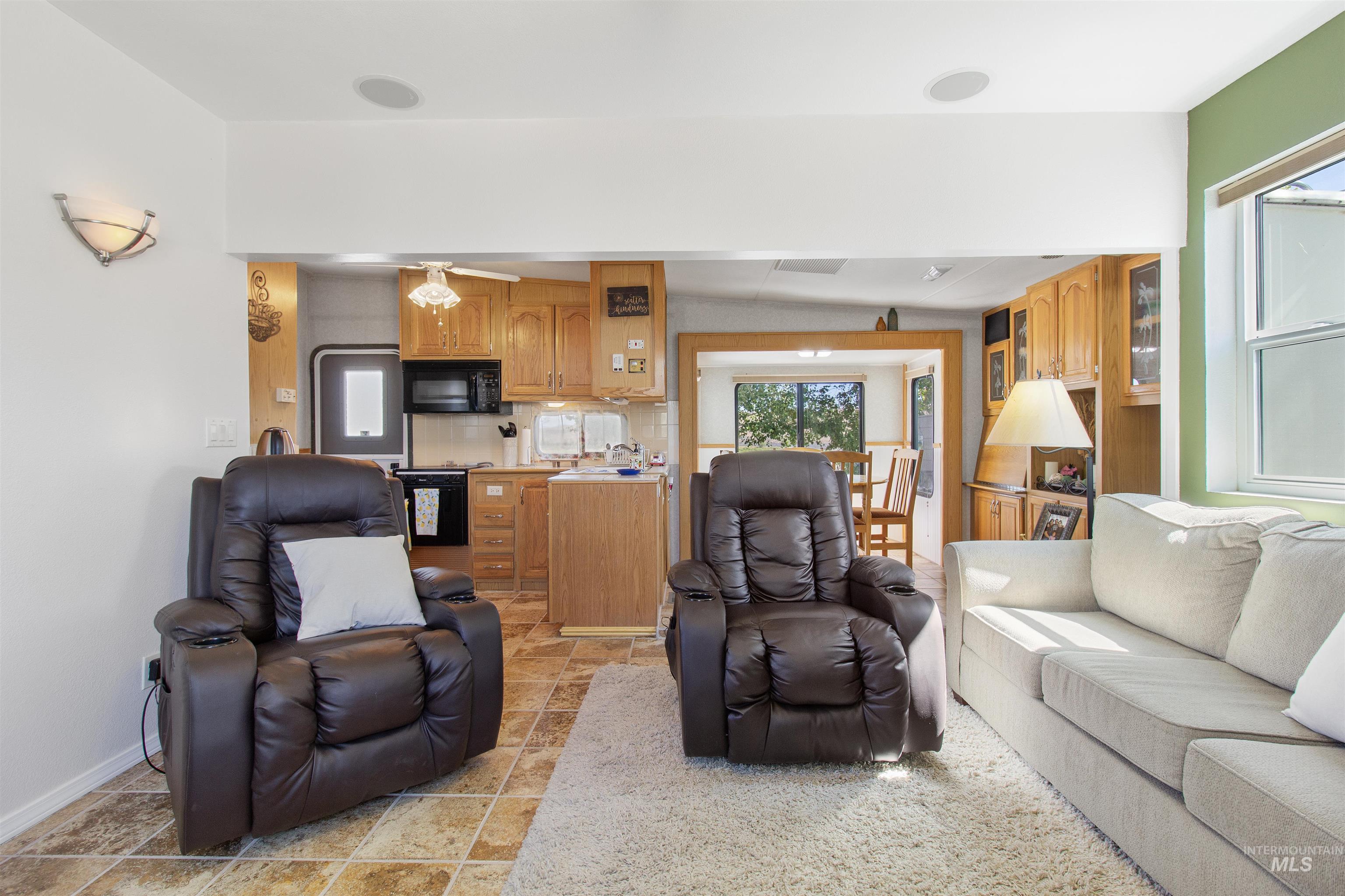 106 West Magic Road Shoshone, ID 83352 - Photo 7 of 45 Open-concept living area featuring integrated recessed lighting and a wall-mounted sconce