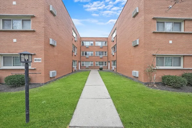 a view of street with parked cars