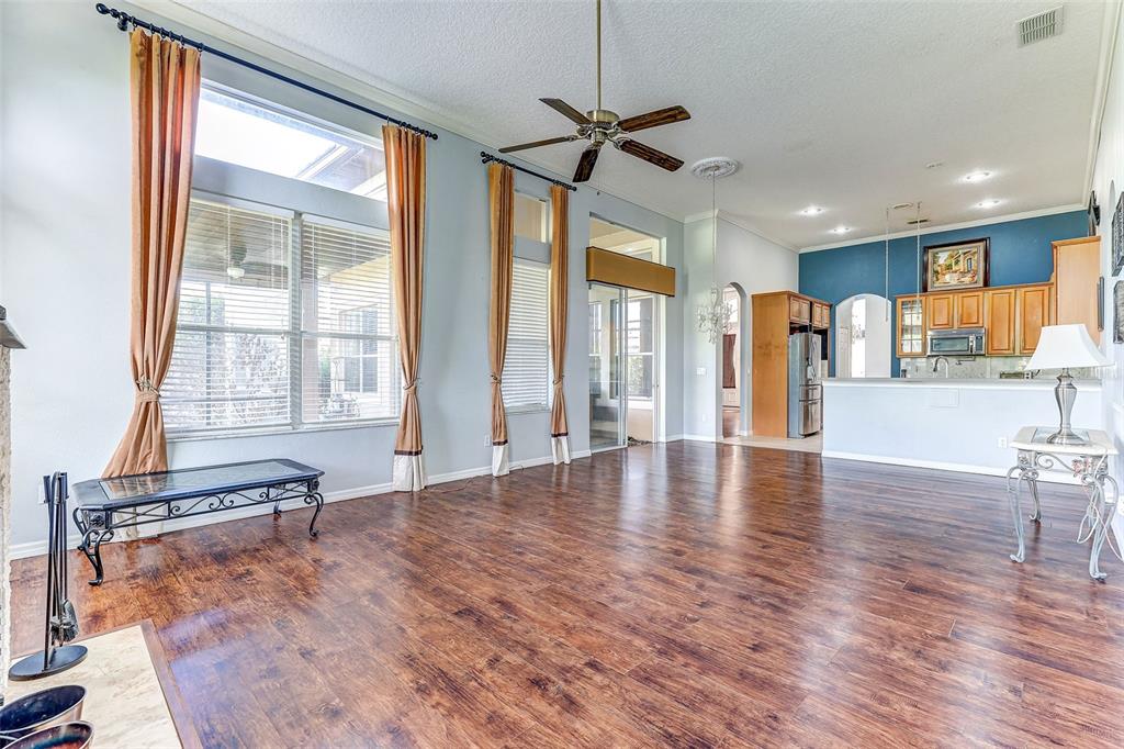918 Algare Loop Windermere, FL 34786 - Photo 21 of 73 a view of an empty room with a window and wooden floor
