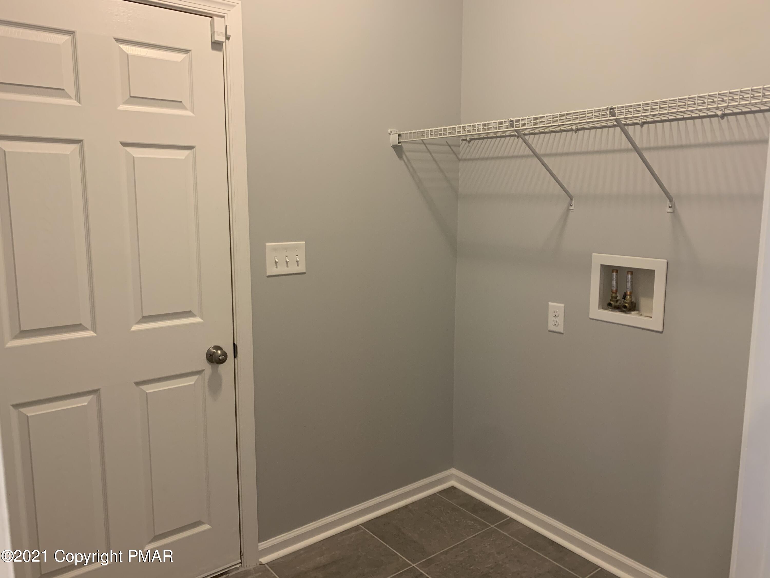 136 Pike Road Bushkill, PA 18324 - Photo 14 of 35 a view of a room with racks on the wall