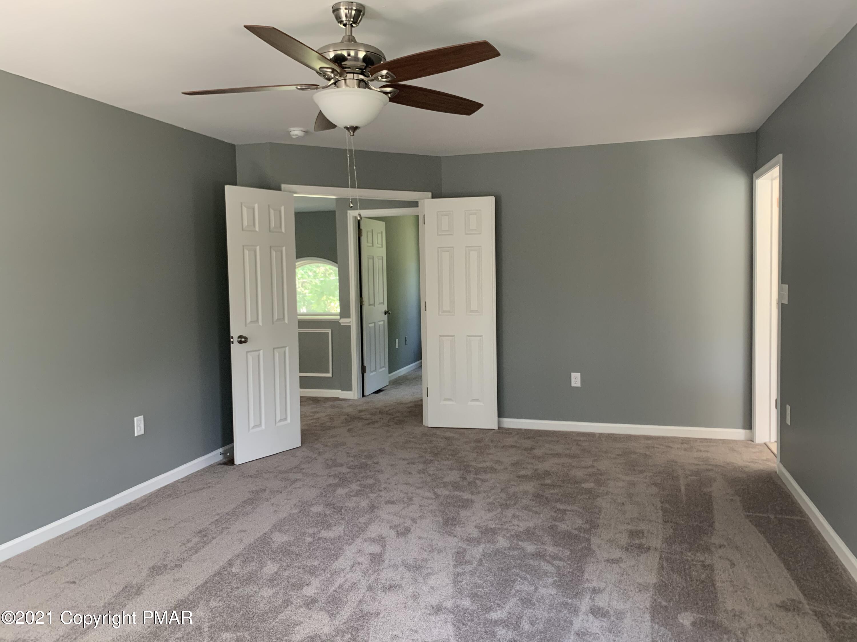 136 Pike Road Bushkill, PA 18324 - Photo 17 of 35 a view of an empty room with a window