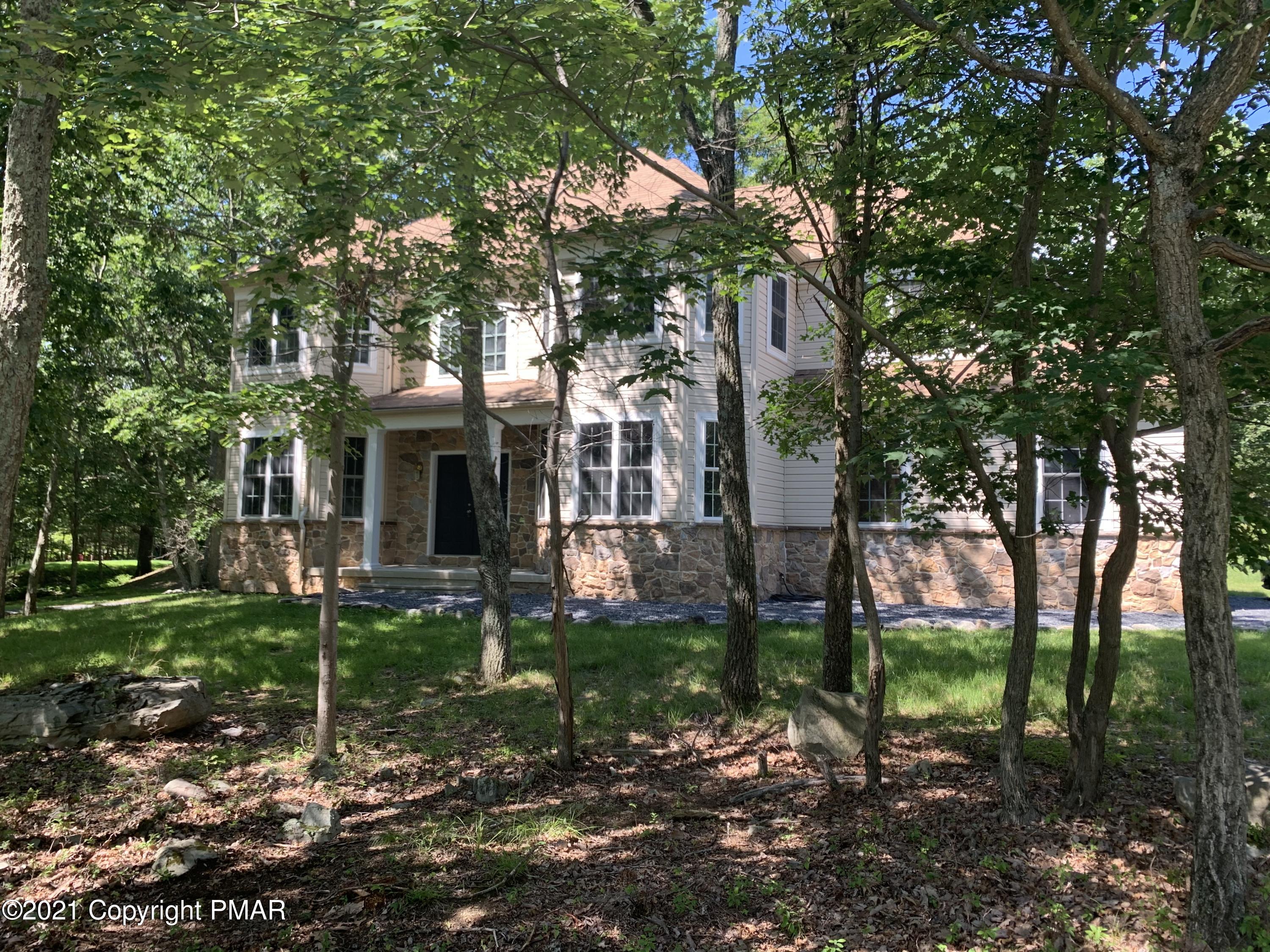 136 Pike Road Bushkill, PA 18324 - Photo 2 of 35 a view of a house with a yard