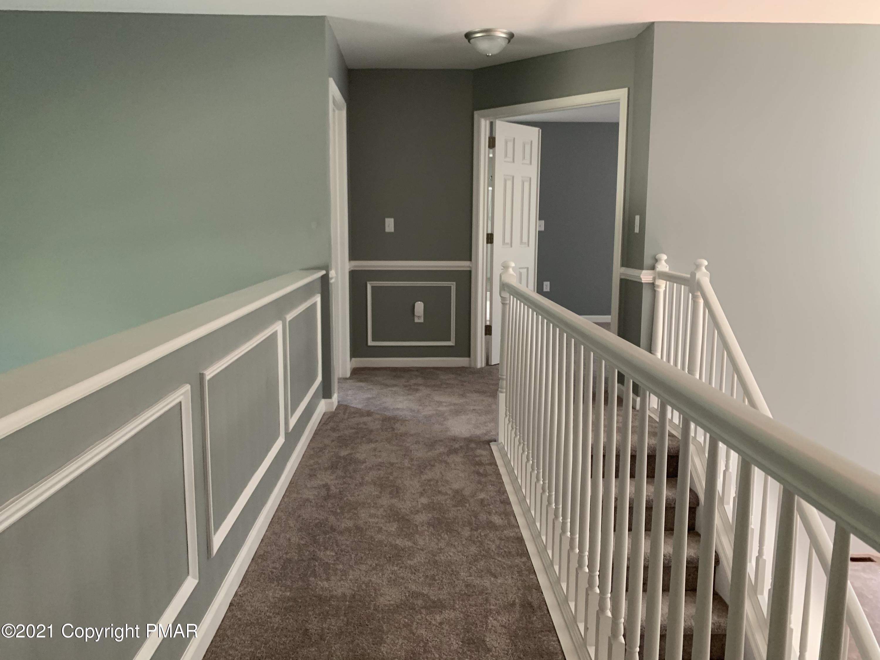 136 Pike Road Bushkill, PA 18324 - Photo 23 of 35 a view of a hallway with wooden floor