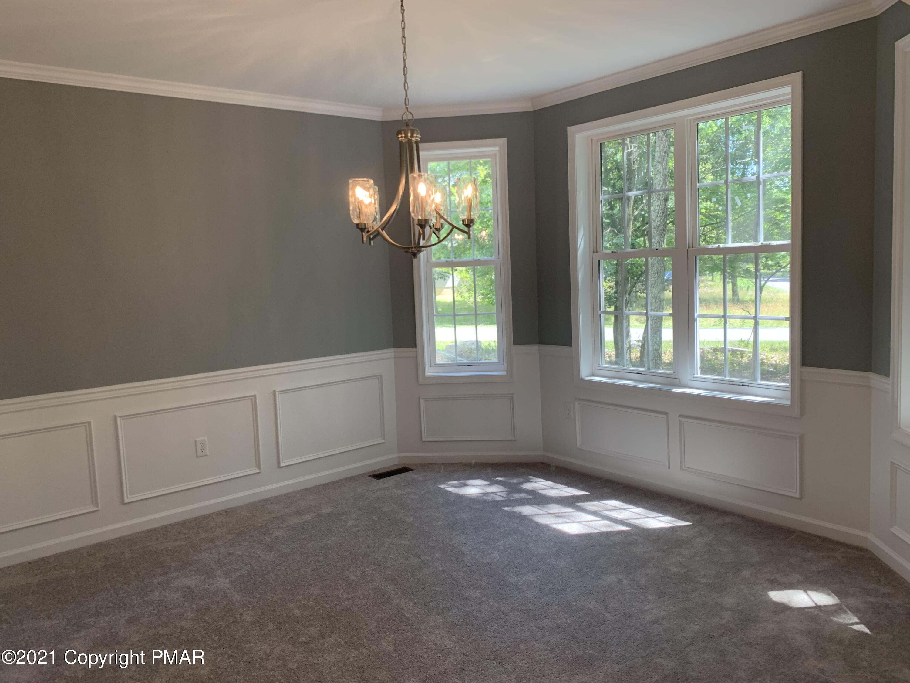 136 Pike Road Bushkill, PA 18324 - Photo 5 of 35 a view of an empty room with a window