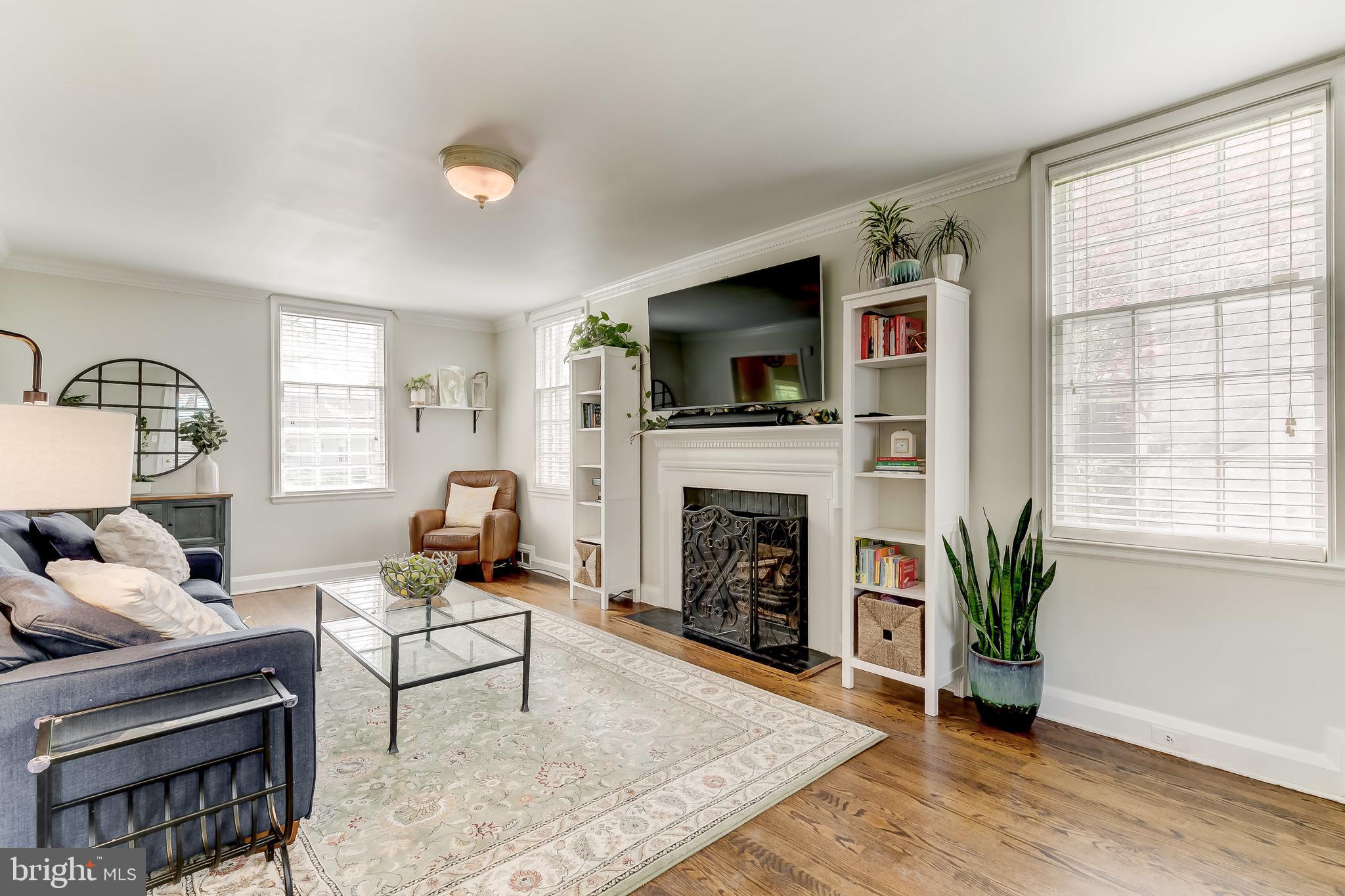 322 Broadmoor Road Baltimore, MD 21212 - Photo 15 of 49 The focus in the living room is the fireplace.