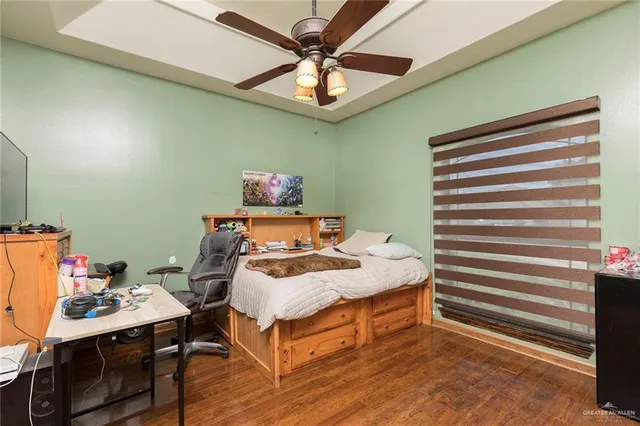 a bedroom with a bed and a table in it